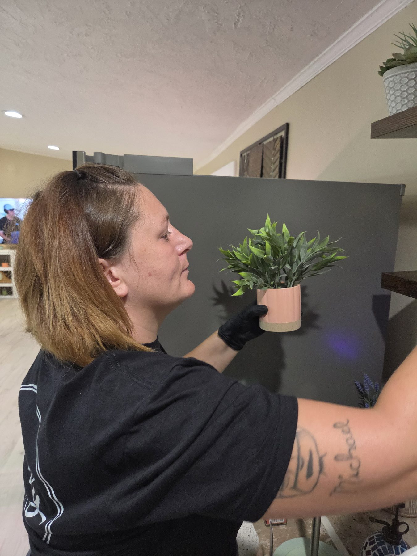 Everly Cleaning Solutions team member attending to a small detail in the home