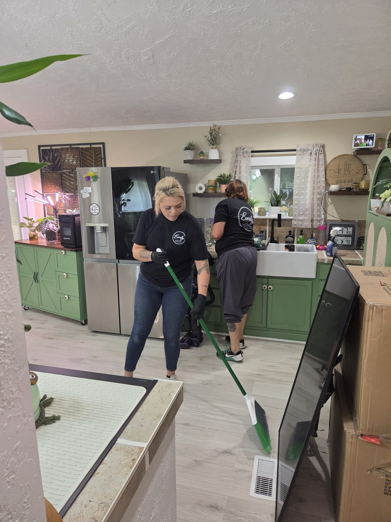 Everly Cleaning Solutions team cleaning a bright kitchen